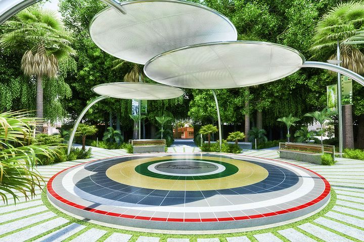 Plaza with circular metal-mesh sunshades and a concentric mosaic on the ground